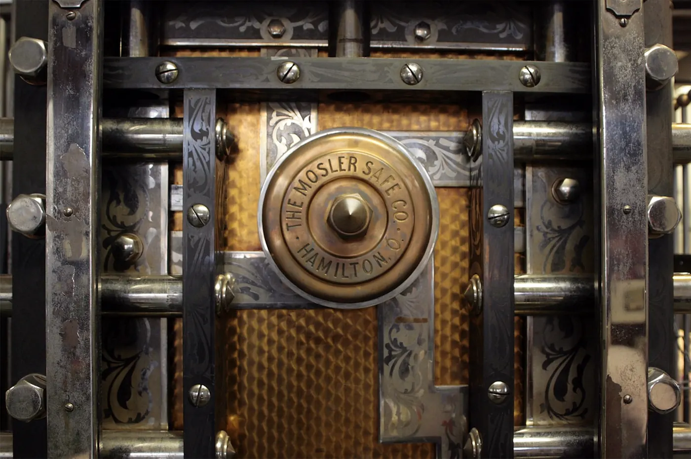 The dial and bolt work of a heavy vault door